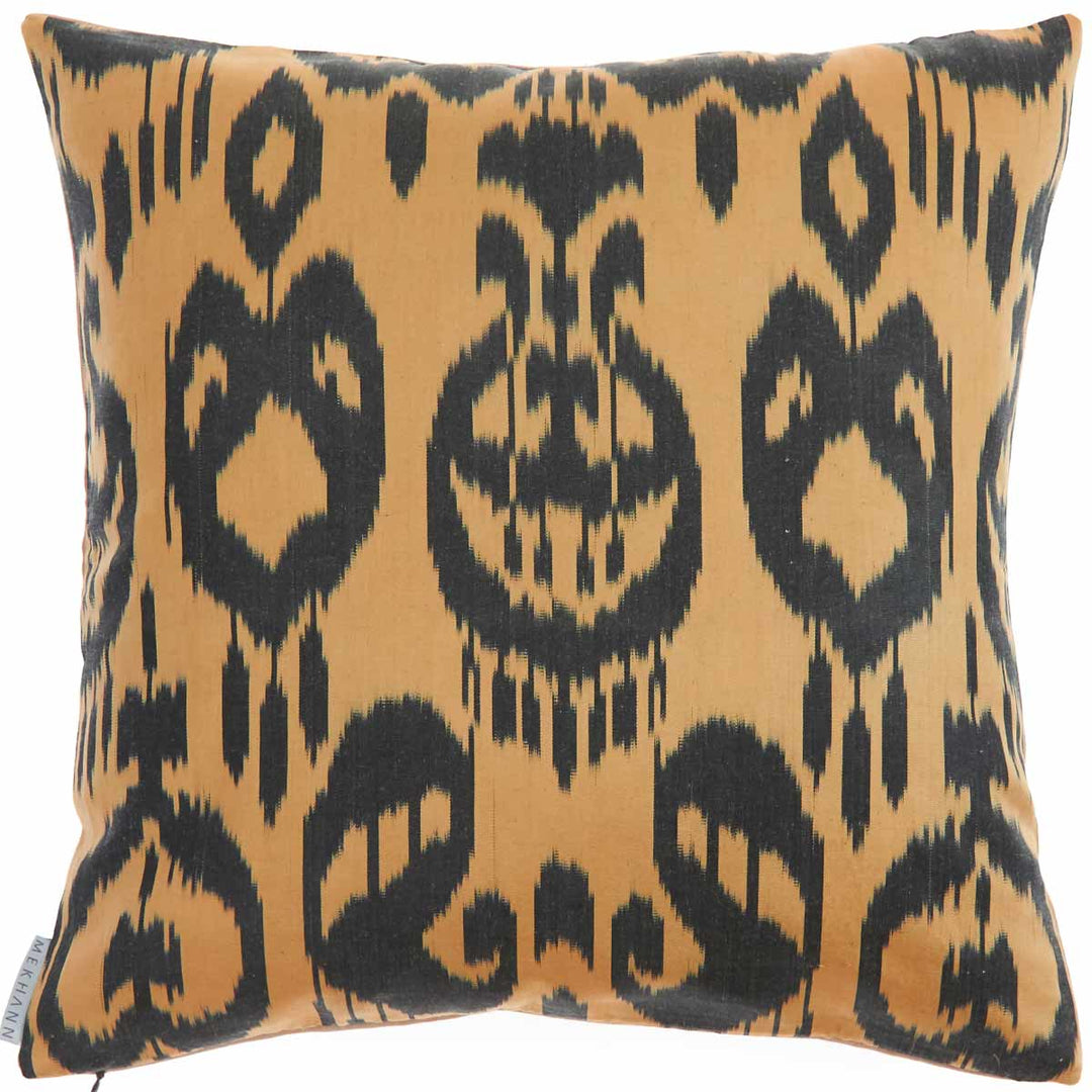 Back view of Mekhann's hand embroidered silk abstract cushion in cream. The ikat lining on the back side can be seen in full, with its black and beige colours on display.