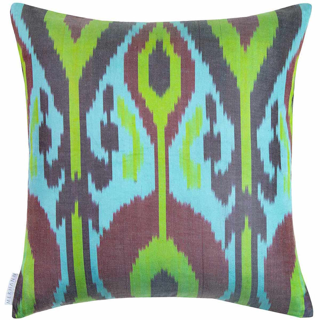 Back view of Mekhann's cream tulips and pomegranates embroidered cushion, revealing the blue and green ikat back lining in full.