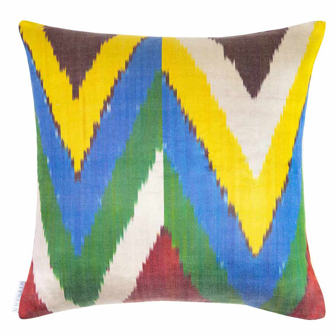Back view of Mekhann's Topkapi embroidered cushion, showing the yellow, blue, green and maroon ikat back face of the cushion.