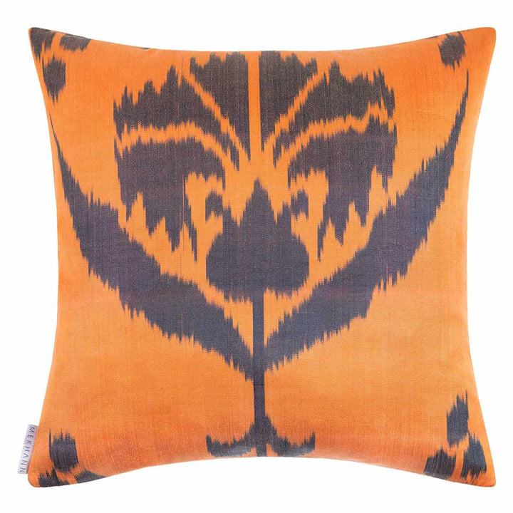 Back view of Mekhann's purple pomegranate embroidered cushion, ikat back lining in orange and black.