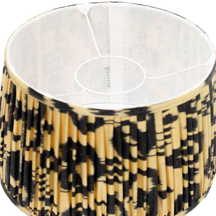 Interior view of Mekhann's black and cream ikat lampshade, showcasing the high-quality silk and unique dye patterns.