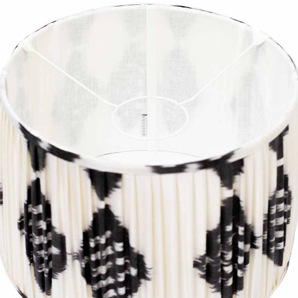 Inside view of Mekhann's black and white ikat lampshade, showing the exquisite detail of the silk fabric and artisanal quality.