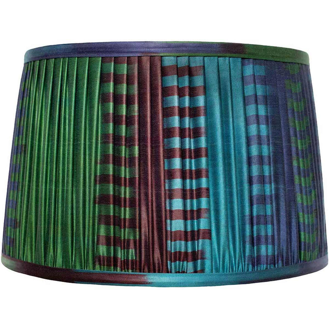 Front view of Mekhann's blue and green ikat silk lampshade, with hand-pleated detailing and eco-friendly dyes for a tranquil effect.