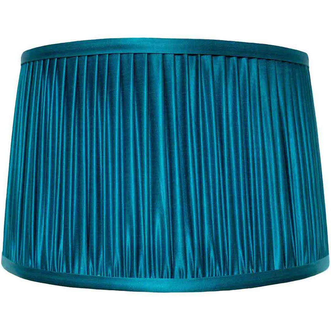 Front view of Mekhann's luxurious blue silk lampshade, featuring exquisite hand-pleated detailing for an elegant home accent.