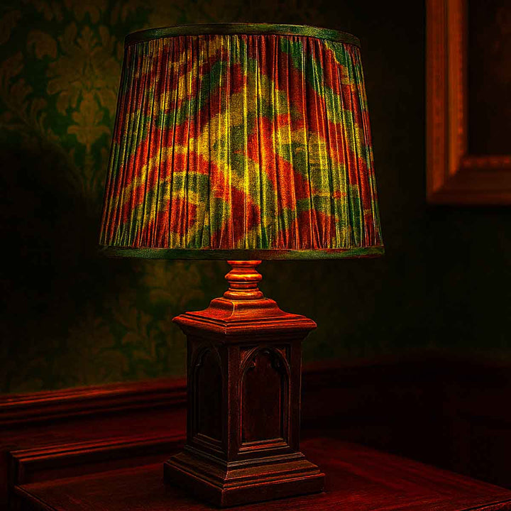 Decorative lamp with a colorful shade in a dimly lit room