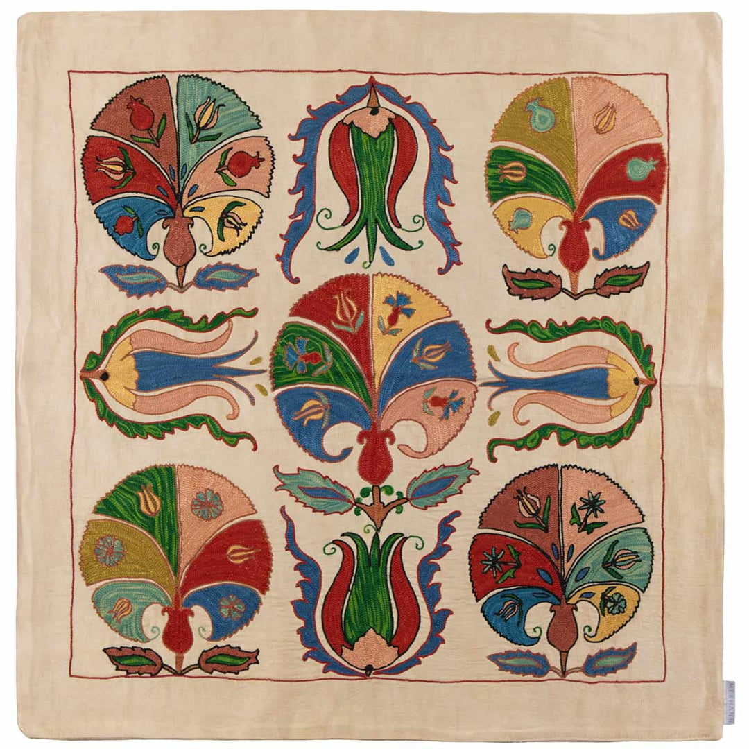 Front view of Mekhann's carnations petite throw, an elegant cream-coloured throw with vibrant carnation embroidery in a symmetrical pattern.