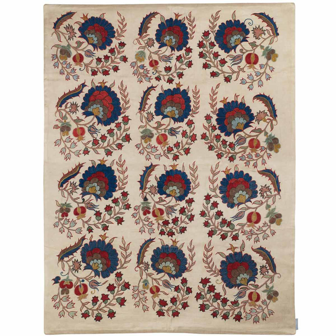 Front view of Mekhann's cream botanical throw, showing the full composition of the botanical throw,  featuring hand embroidered silk botanical motifs.