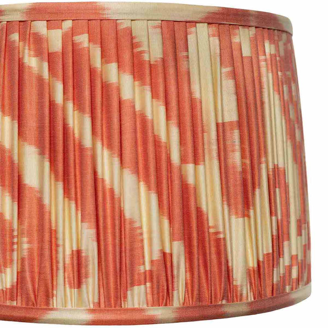 Close-up of the cream and orange ikat pattern on Mekhann's lampshade, highlighting the artisanal quality and colour depth.