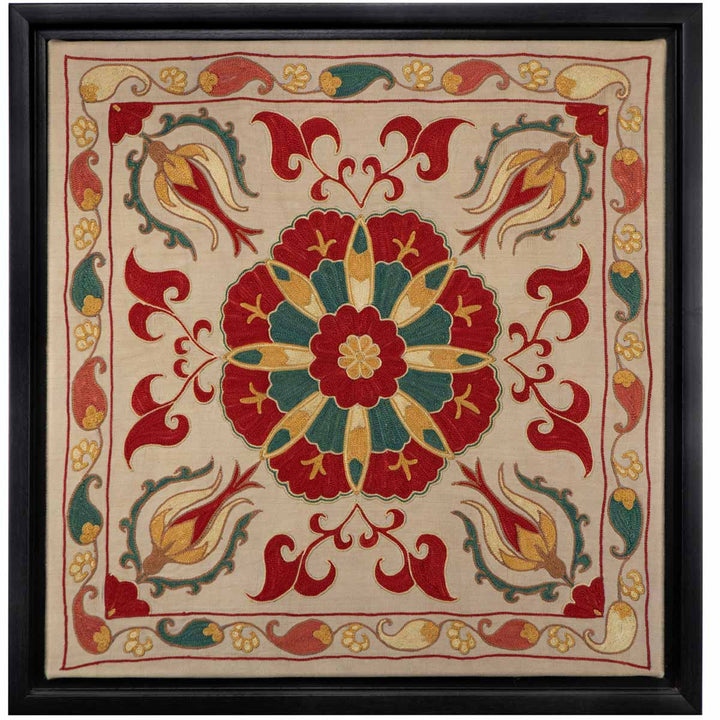 Front view of Mekhann's cream silk botanicals artwork, displaying a cream canvas adorned with a symmetrical arrangement of colourful botanical embroidered designs, all within its black frame.