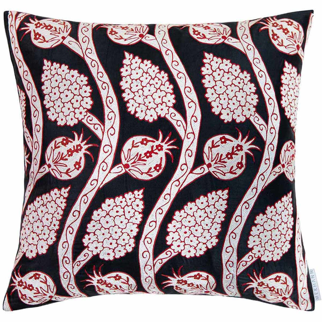 Front view of Mekhann's black grapes and pomegranates embroidered cushion, where we can see a collection on red and cream coloured embroidered pomegranates and grapes growing from vines. All of the design motifs have been hand embroidered on a base of black silk.