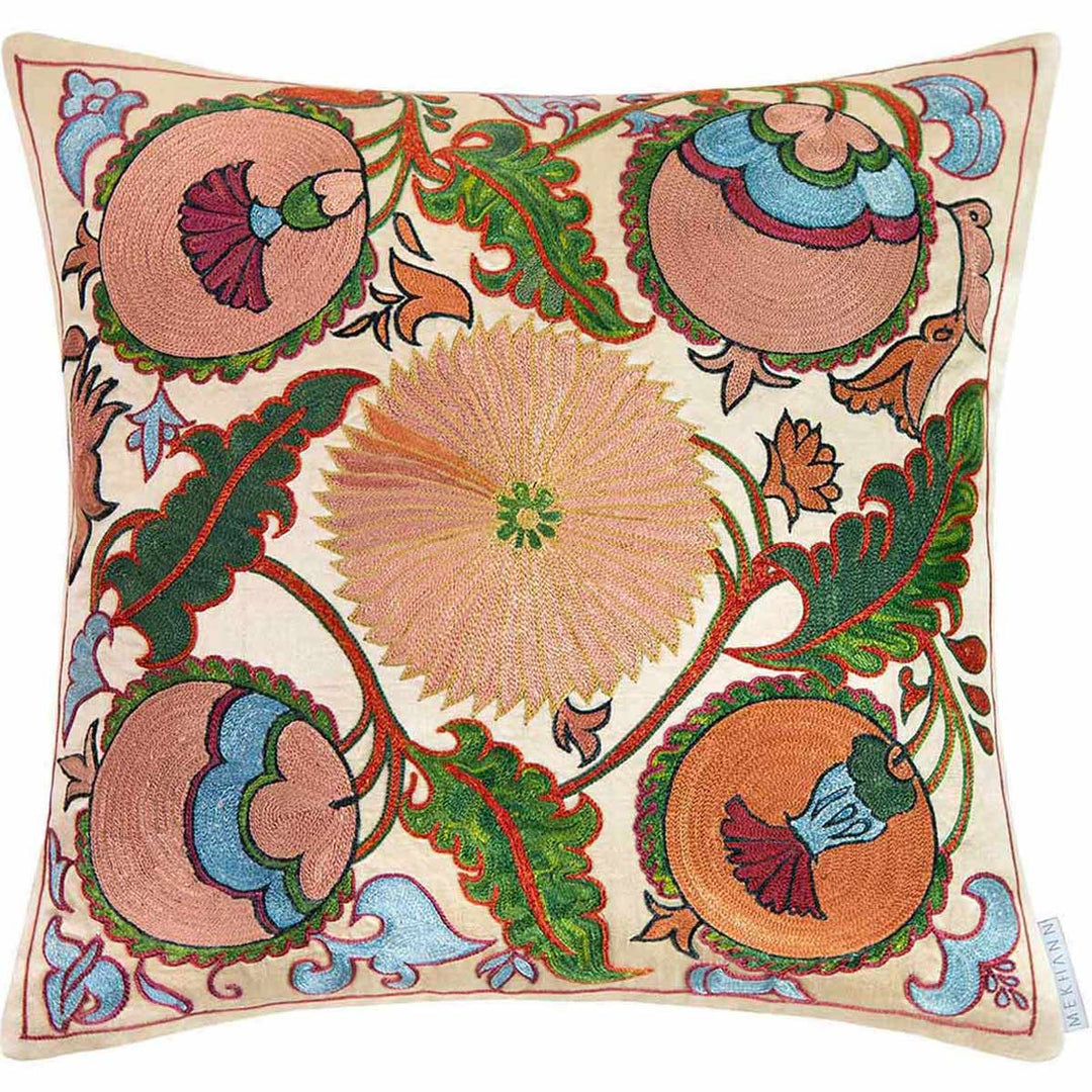 Front view of Mekhann's hand embroidered silk iznik cushion in cream. Showing the full composition of the iznik designed cushion, we can see flowers, leaves and pomegranates as the main embroidered design motifs.