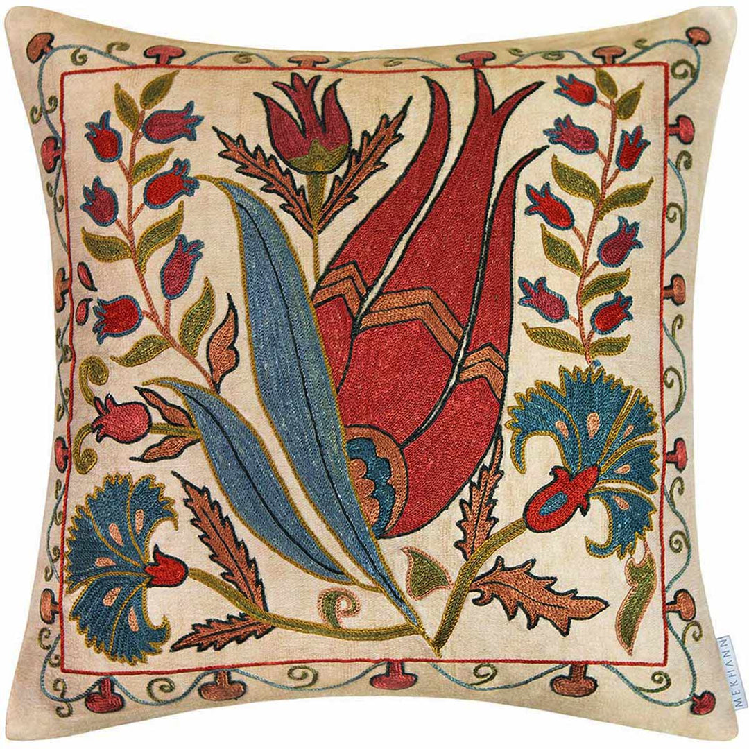 Front view of Mekhann's cream tulips embroidered cushion, this cushion showcases one large, red, tulip motif surrounded by smaller flowers and leaves, all designs have been hand embroidered using silk yarns on to a cream base.