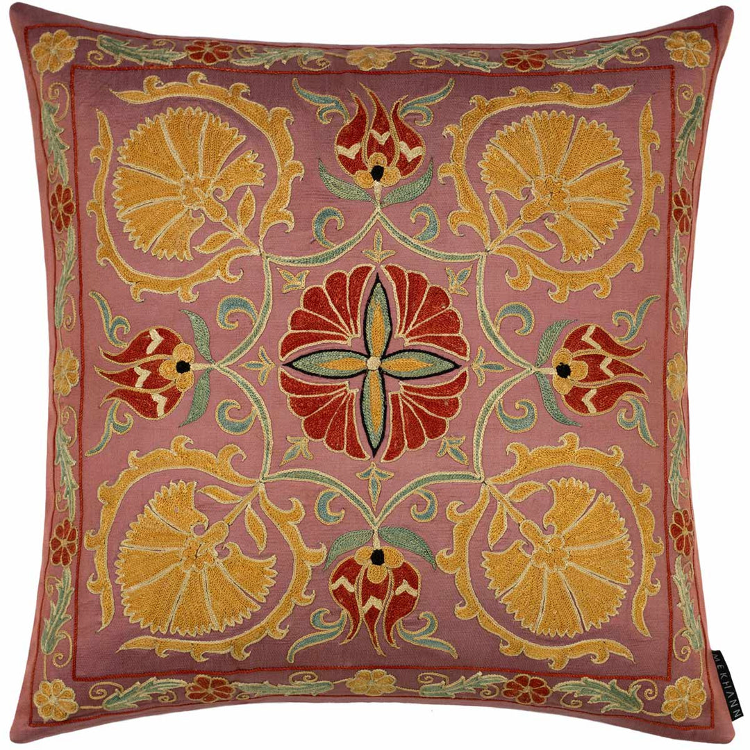 Front view of Mekhann's tulips and carnations embroidered cushion, where we can see an organised collection of carnation and tulip motifs that have all been had embroidered onto a light maroon silk canvas.