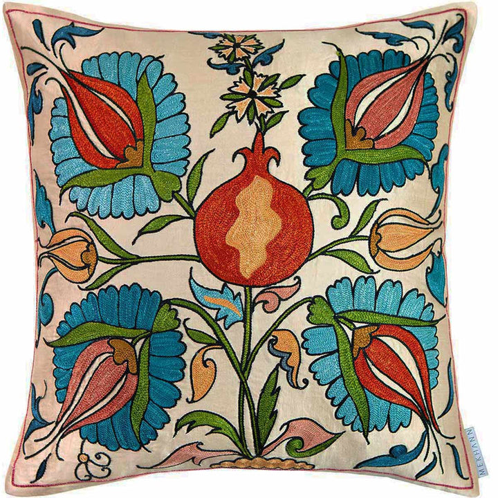 Front view of Mekhann's cream tulips and pomegranates embroidered cushion, revealing the full display of four main embroidered tulips and one main centre pomegranate, all hand embroidered in blue, red, green and beige hues.