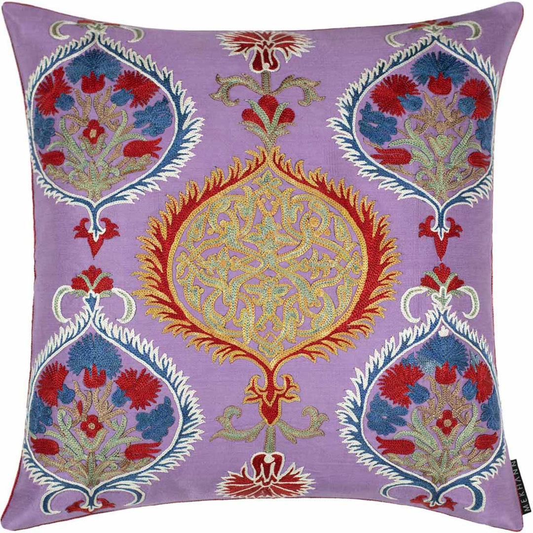 Front view of Mekhann's multicoloured Topkapi embroidered cushion, showing all the topkali inspired embroidered all finished on a base of purple silk.