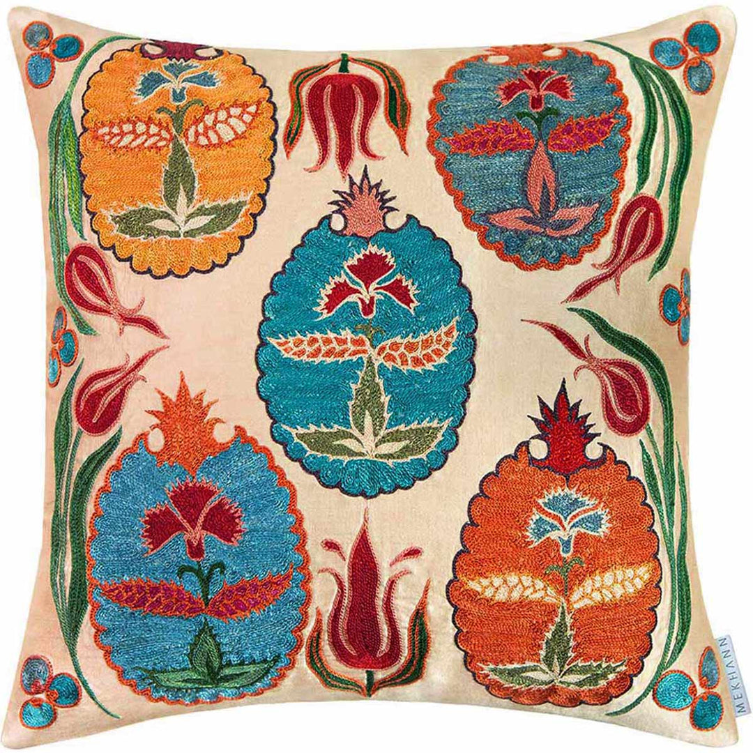 Front view of Mekhann's cream abstract Topkapi embroidered cushion, showcasing four main embroidered motifs in blue orange and yellow with many details.