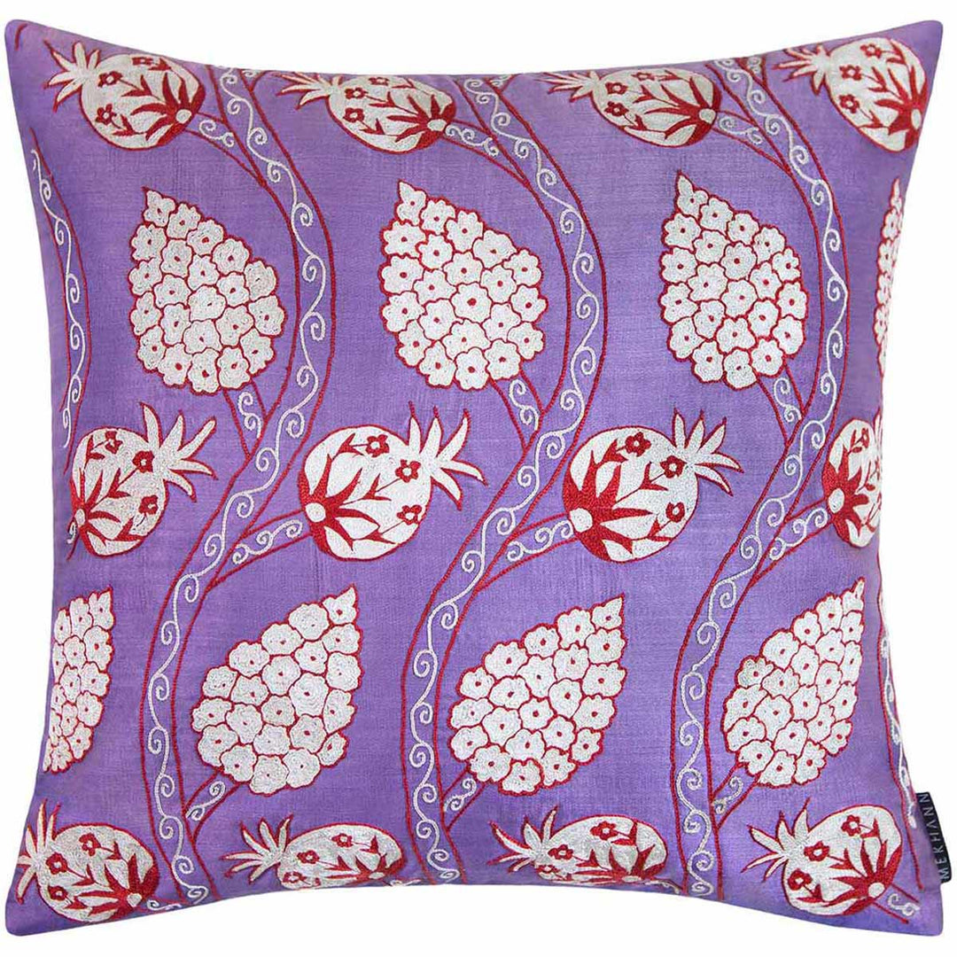 Front view of Mekhann's grapes and pomegranates embroidered cushion, Showing the full composition of pomegranate and grapes design, all hand embroidered and created using cream and red silk yarns on a base of purple silk.