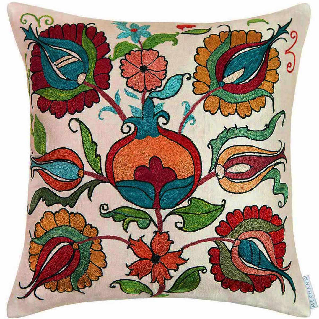 Front view of Mekhann's cream Tulips and Pomegranates embroidered cushion, all hand embroidery in bright colours onto a cream coloured silk canvas that allows for the colours to pop.