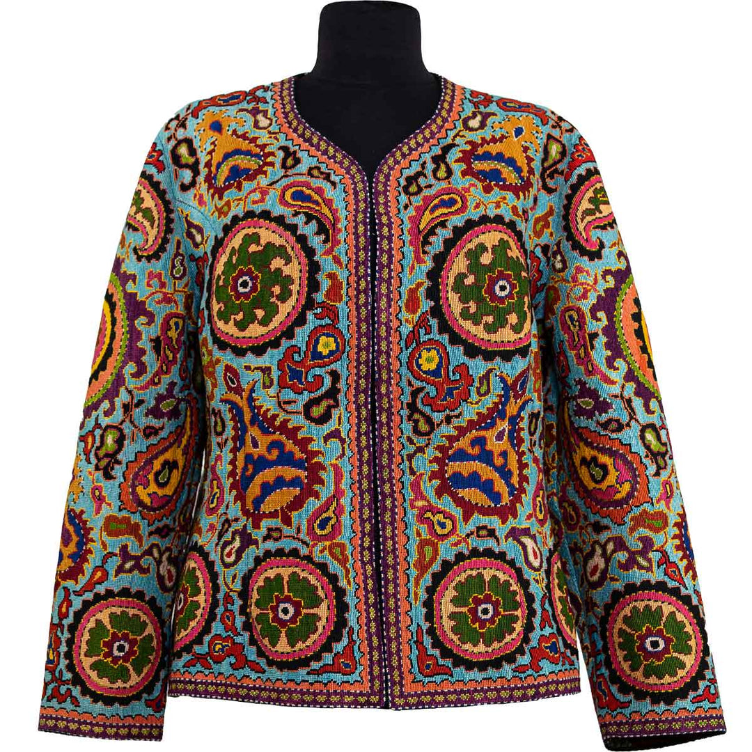 Front view of Mekhann's fully embroidered plena consuta jacket, with light blue as the dominant base colour, the jacket is covered in colourful fully embroidered medallion motifs.