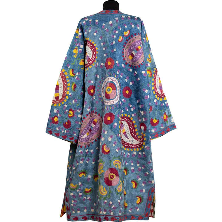 Back view of Mekhann's fully embroidered lividus kaftan in navy, showing the consistency in the silk embroidery that covers the entire back of the kaftan.