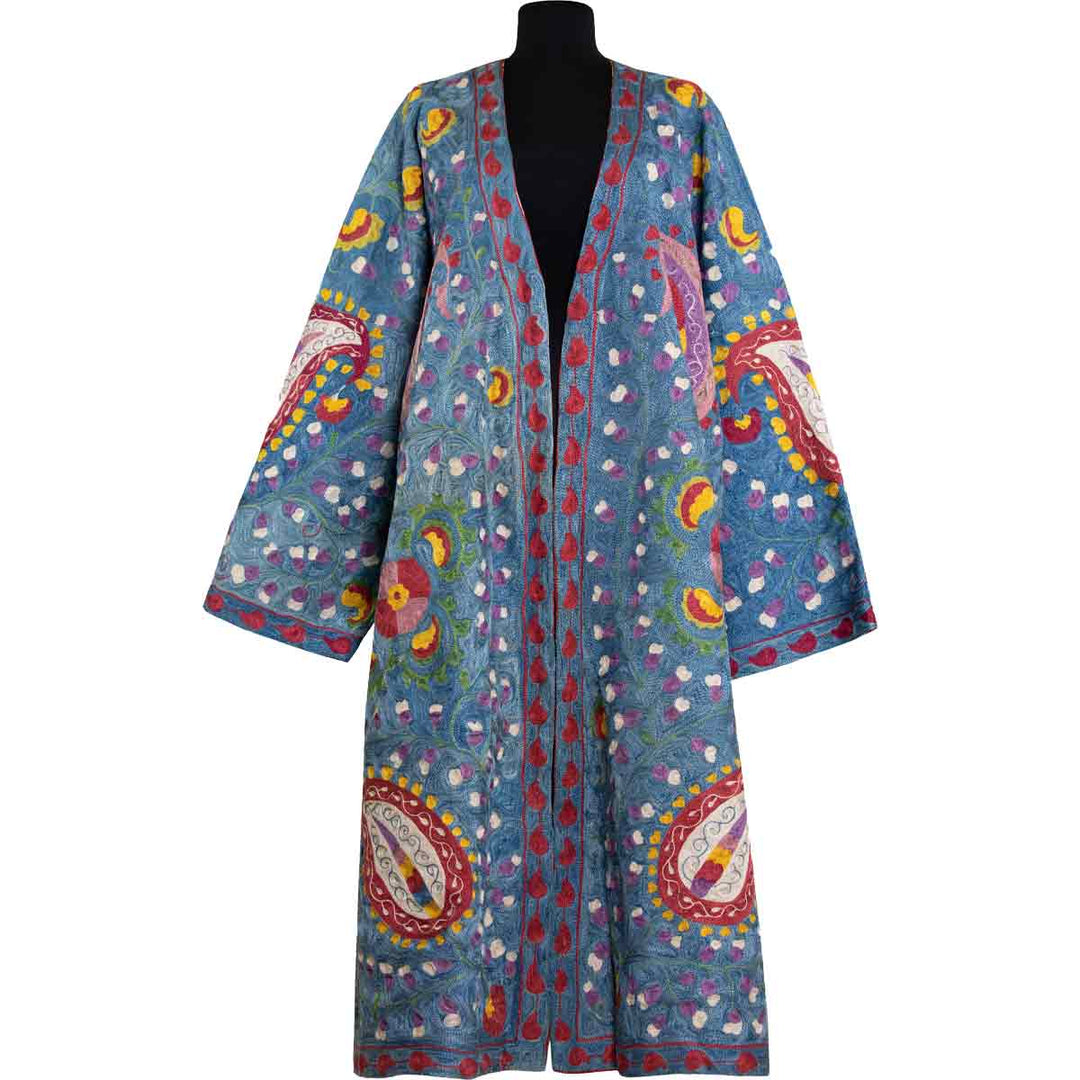 Front view of Mekhann's fully embroidered lividus kaftan in navy, showcasing s vibrant collection of bright patterns that have been fully embroidered using silk yarns.