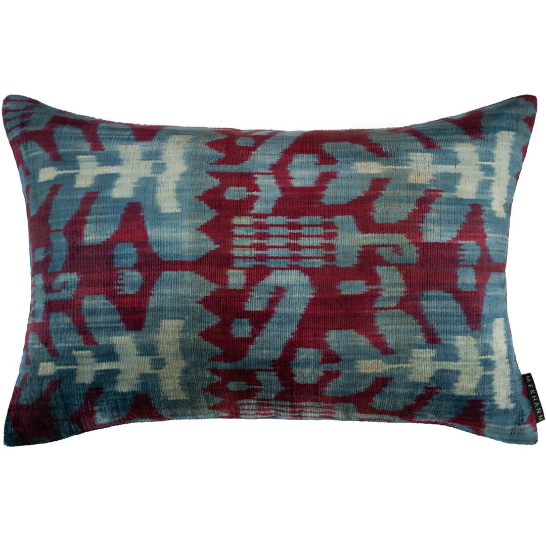 Handwoven silk velvet Ikat cushion in royal purple and azure, featuring the Sagitta pattern—crafted using traditional resist-dyeing techniques