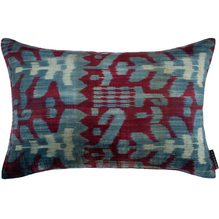 Handwoven silk velvet Ikat cushion in royal purple and azure, featuring the Sagitta pattern—crafted using traditional resist-dyeing techniques