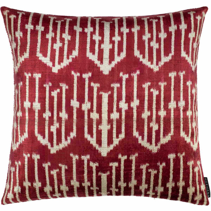 Handwoven silk velvet Ikat cushion in deep crimson and burgundy, featuring the Spearhead motif with bold geometric precision and traditional resist-dyeing craftsmanship