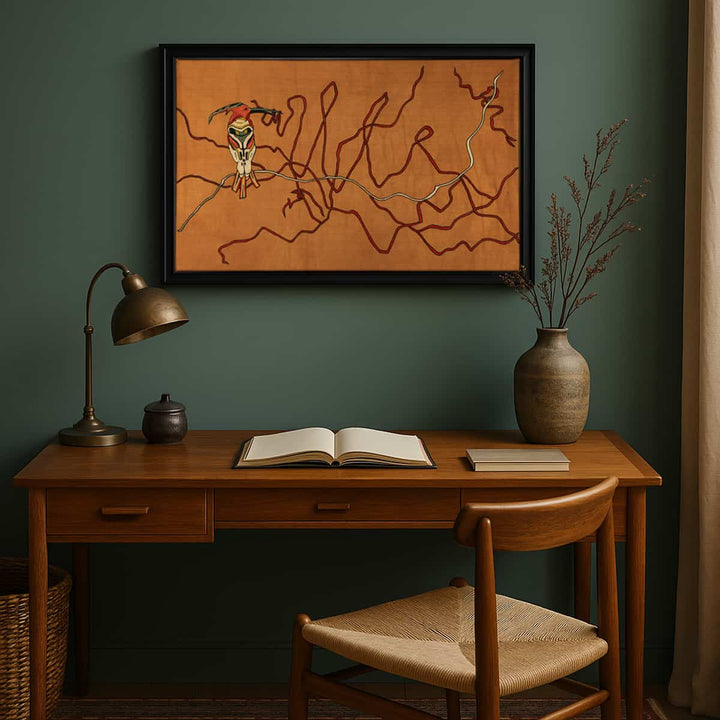 A framed artwork depicting abstract brown lines on a wall, with a desk, chair, lamp, and decorative items arranged below it.