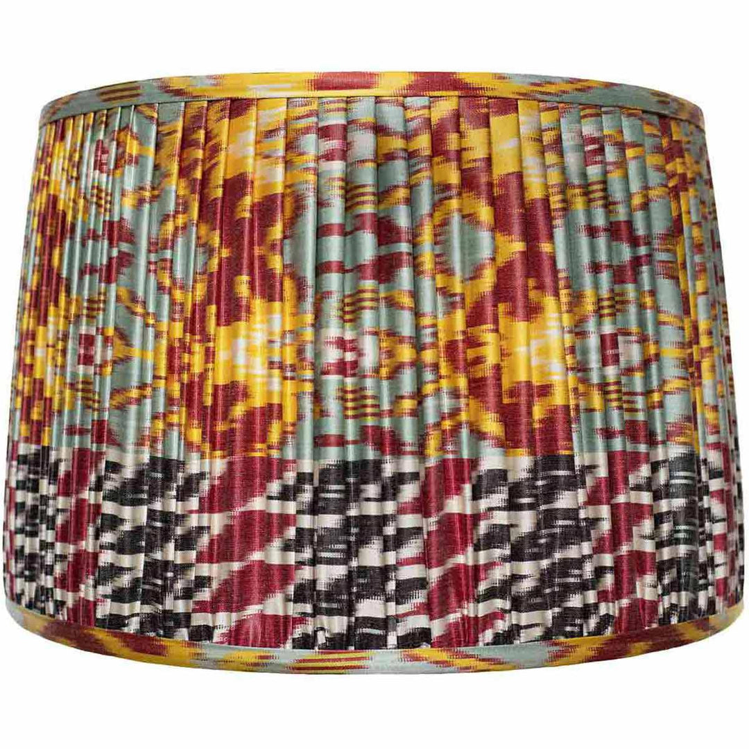 Large multicolour ikat silk lampshade from Mekhann, a statement decor piece with rich colours and hand-pleated detail for luxury interiors.