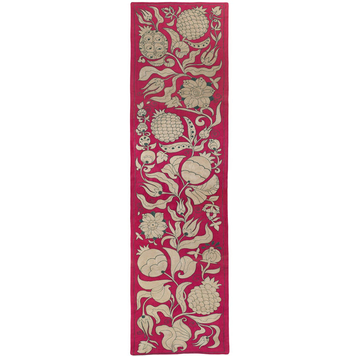 Front view of Mekhann's pink ottoman vines runner, Featuring an elegant array of cream floral and fruit patterns all set on a silk pink fabric to allow the hand embroidered motifs to stand out.