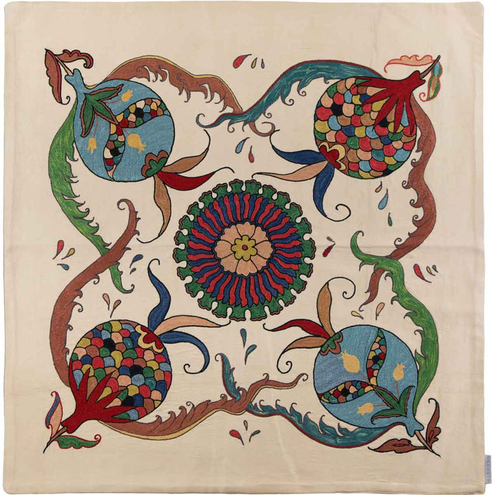 Front view of Mekhann's pomegranate cream petite throw, featuring intricate embroidery with classic hand embroidered pomegranate patterns on a cream coloured silk in full view.