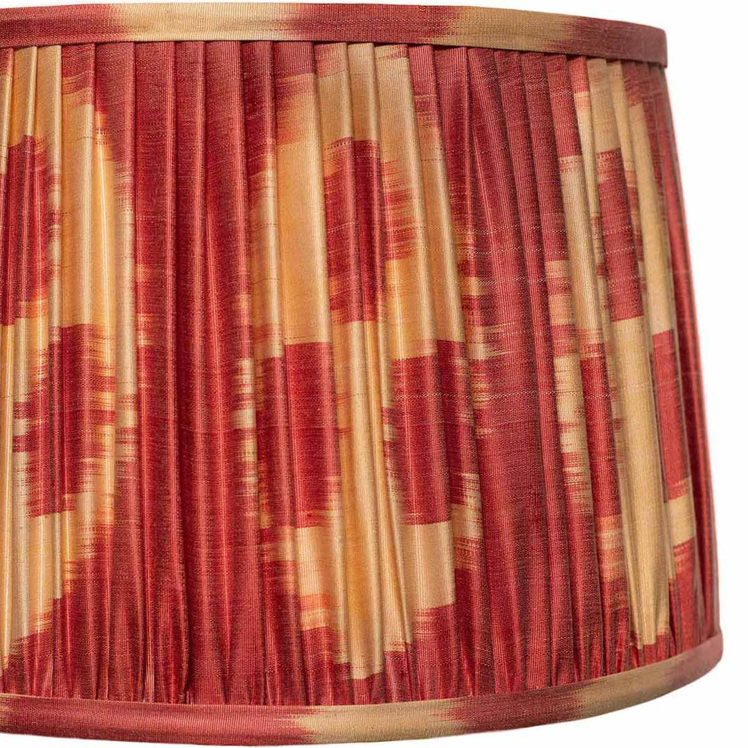 Close-up of the vibrant ikat pattern on Mekhann's lampshade, highlighting the precision of hand-pleating and colour depth.