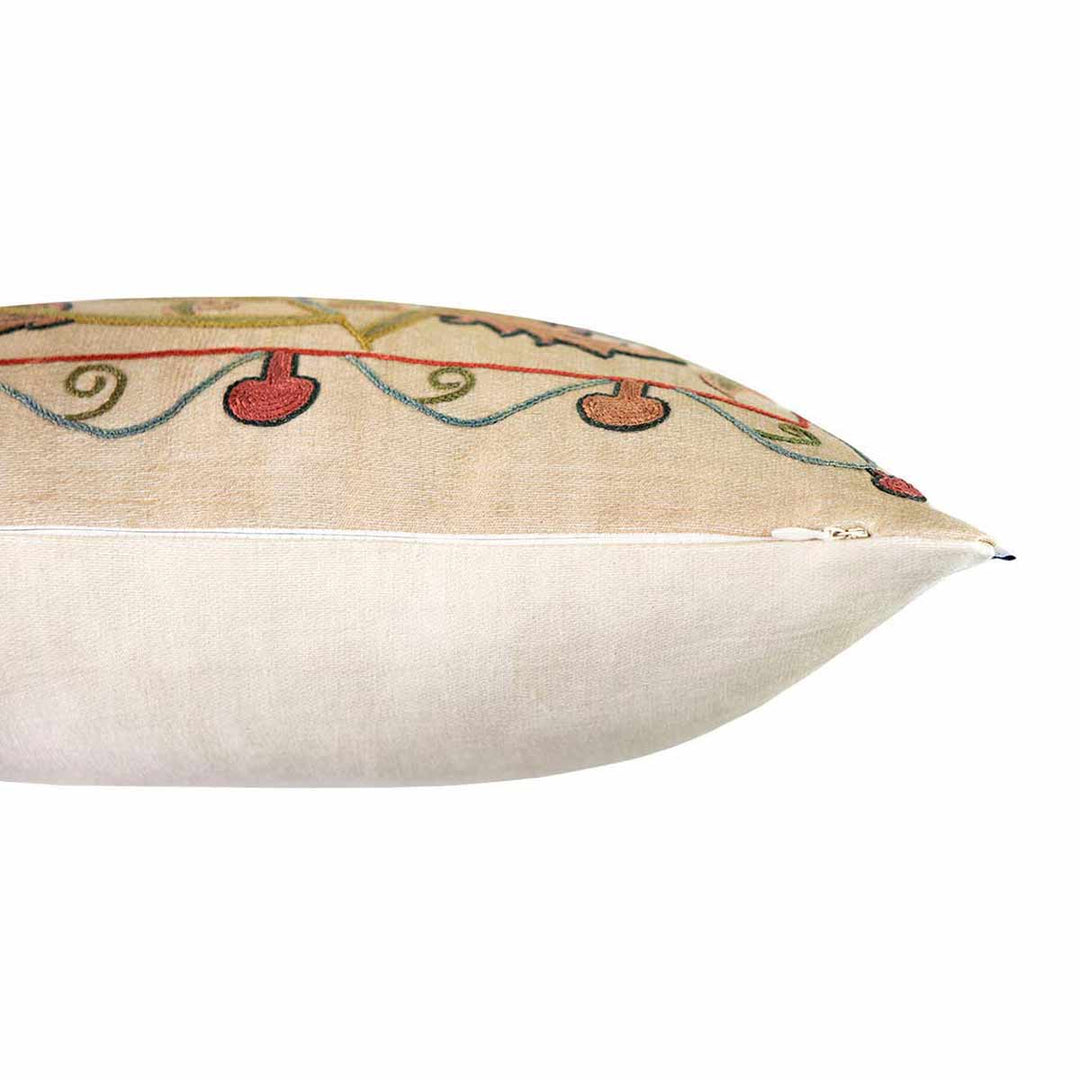 Side view of Mekhann's cream tulips embroidered cushion, here we can see where the cream front base meets the cream base face of the cushion.