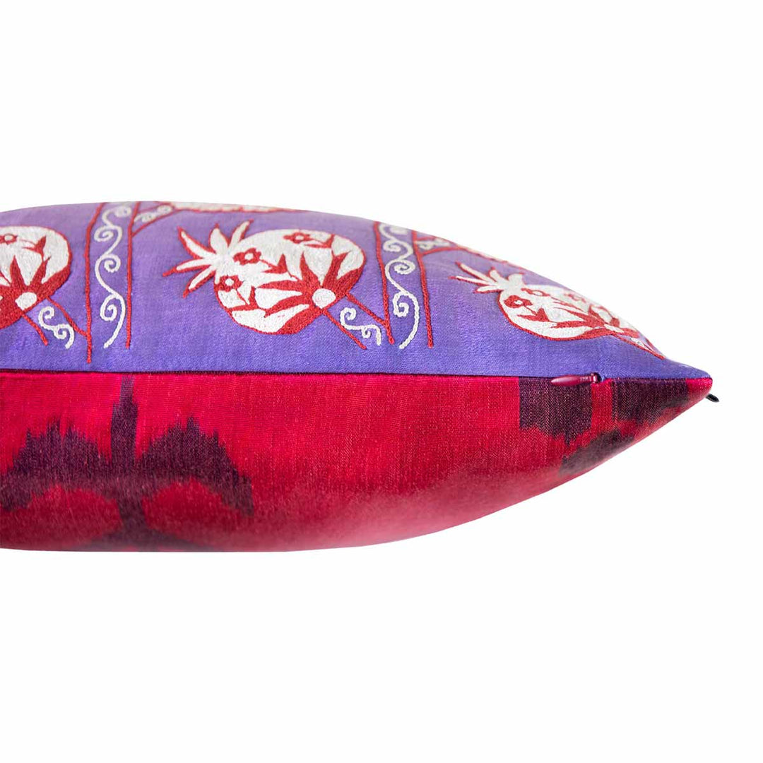 Side view of Mekhann's grapes and pomegranates embroidered cushion, here we can see where the back maroon ikat lining meeting the purple silk canvas of the front of the cushion.