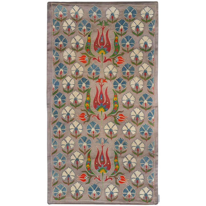 Front view of Mekhann's grey tulip runner, with a central pattern of red and blue tulips, adorned with floral designs, offering a classic yet contemporary look, all have been hand embroidered using silk yarns onto a grey silk fabric base.