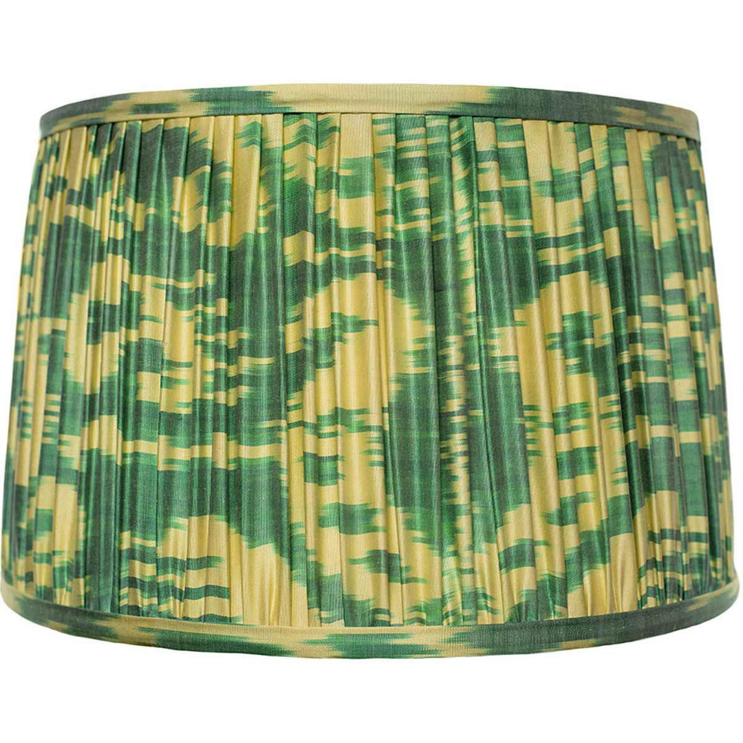 Front view of Mekhann's two-tone green silk ikat lampshade, hand-pleated with vibrant, sustainable dyes for an earthy feel.