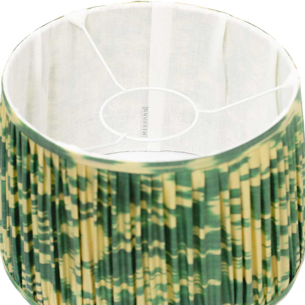 Interior view of Mekhann's green ikat lampshade, revealing the natural weave of the silk and the richness of the green hues.