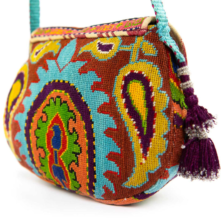 Back view of Mekhann's blue and multicoloured arabesque embroidered cross-body bag, showing the continued attention to detail in every aspect of the bag.