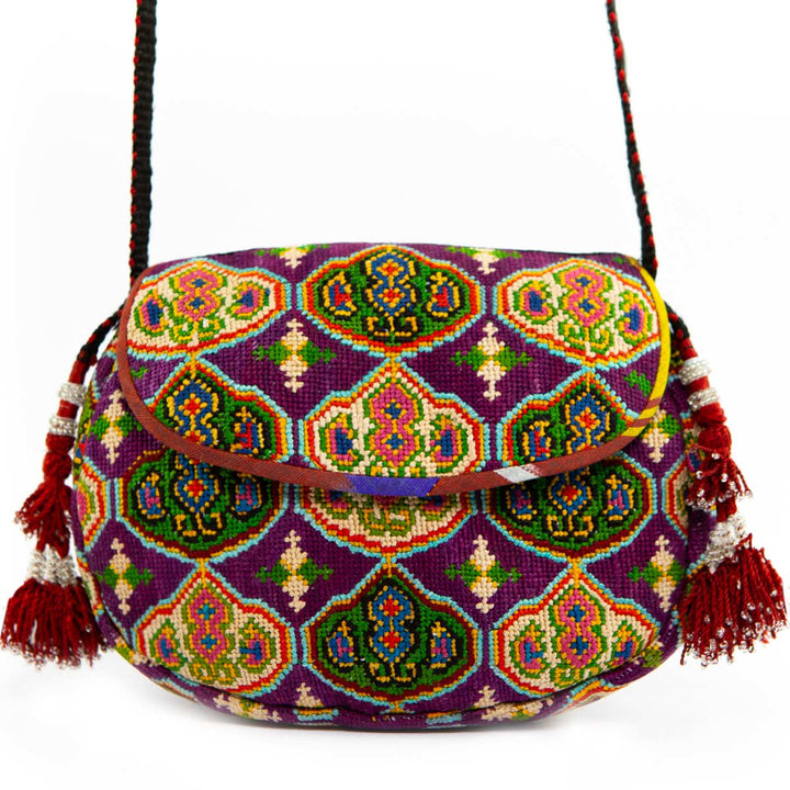 Front view of Mekhann's royal purple arabesque embroidered cross-body bag, displaying all the design details in a variety of bright colours. 