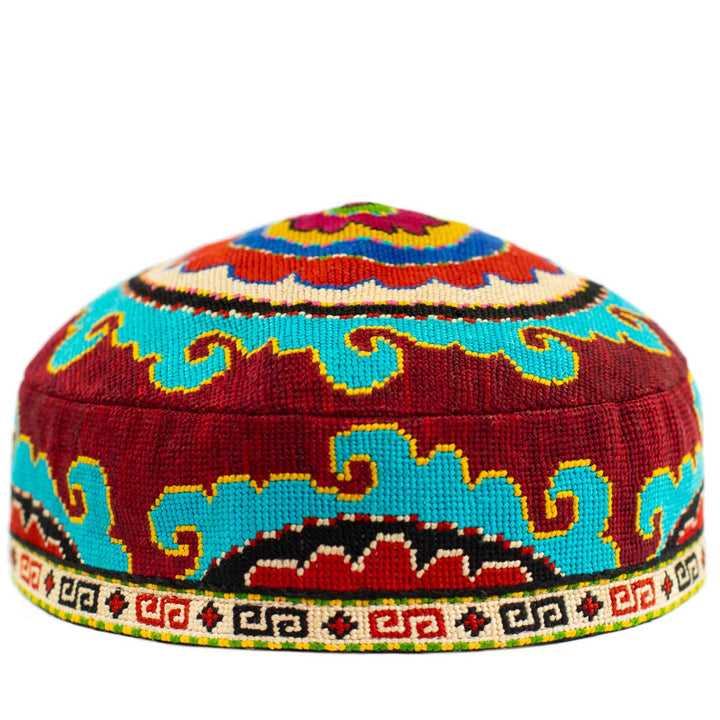 Front view of Mekhann's multicoloured arabesque skull cap, showcasing bright tones of blue and maroon to add colour to any outfit.