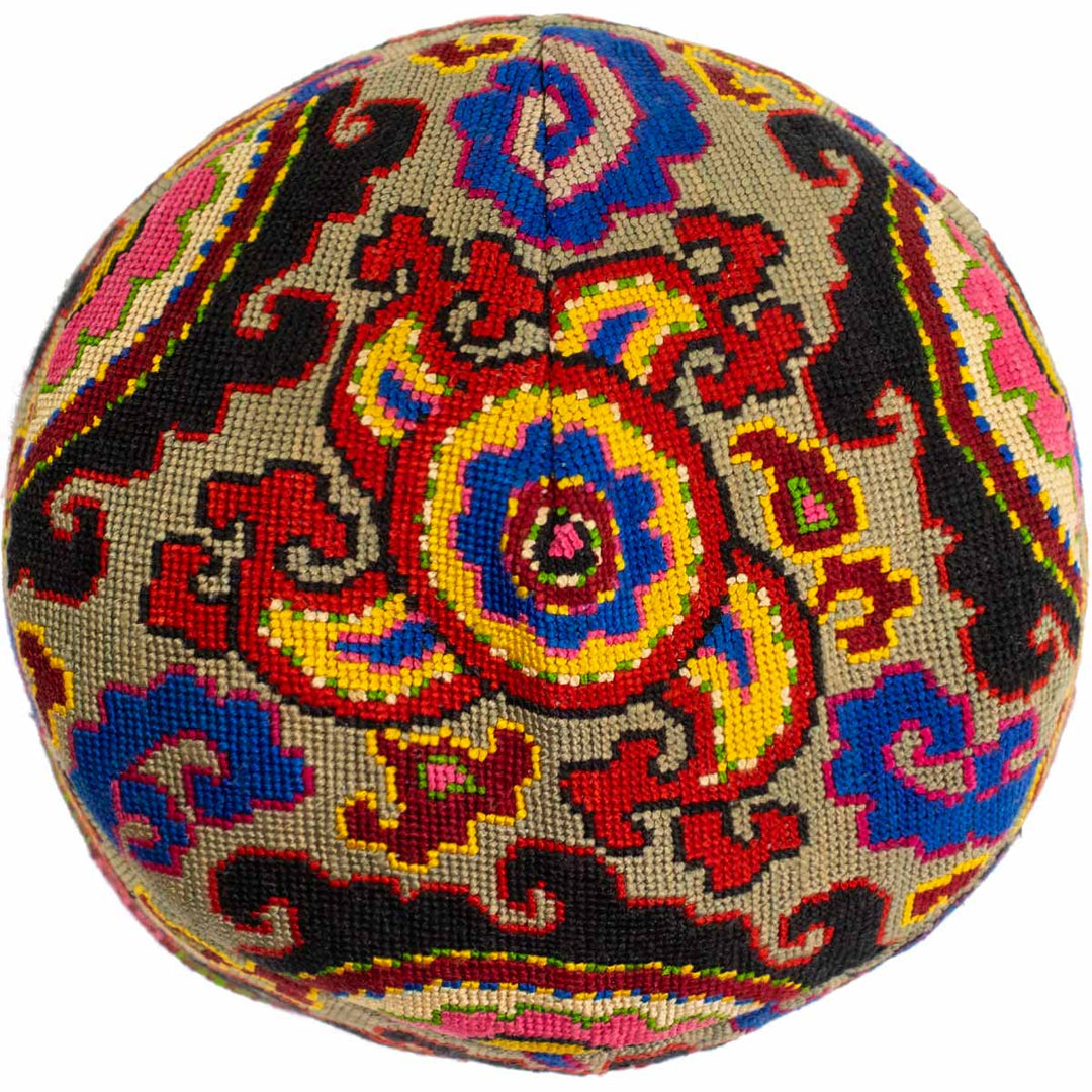 Top view of Mekhann's arabesque multicoloured skull cap, with the full top pattern on display showing the attention to detail in the design.