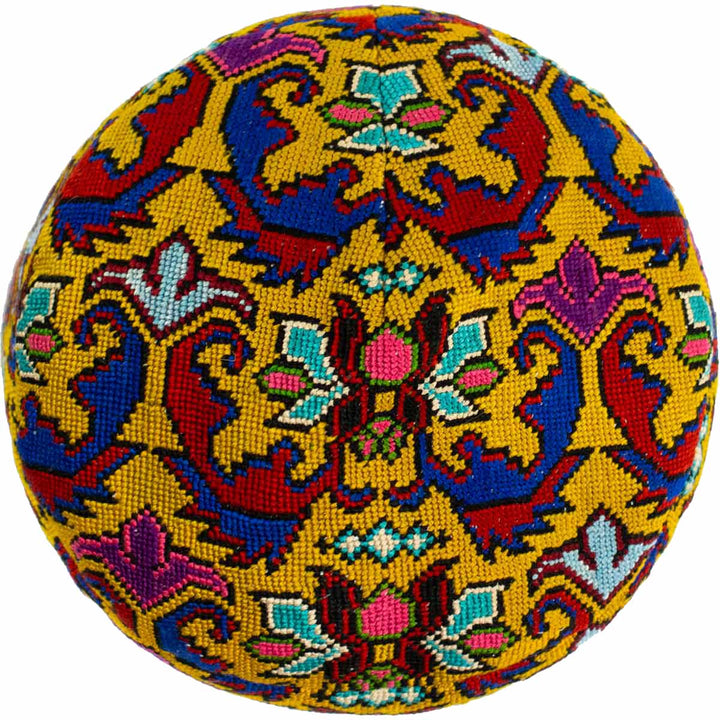 Top view of Mekhann's arabesque yellow skull cap, showcasing all the detail of the arabesque cross stitched skull cap.