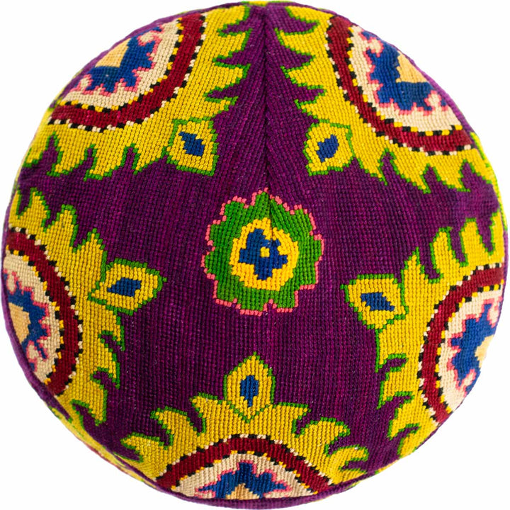 Top view of Mekhann's purple arabesque skull cap, exposing the full embroidered silk pattern onto of the skull cap featuring a collection of hand embroidered patterns.