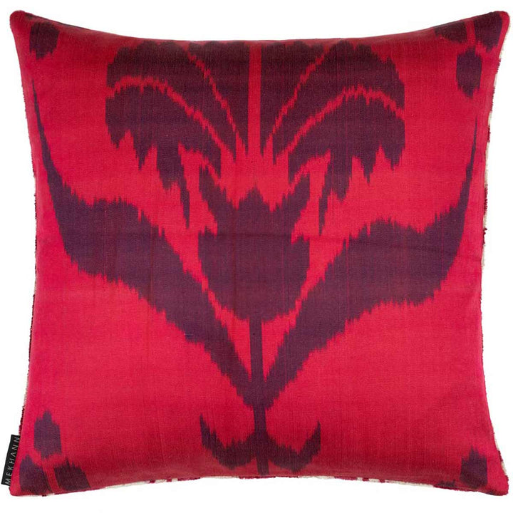 Back view of Mekhann's abstract maroon pattern velvet cushion, revote maroon ikat lining in full display.