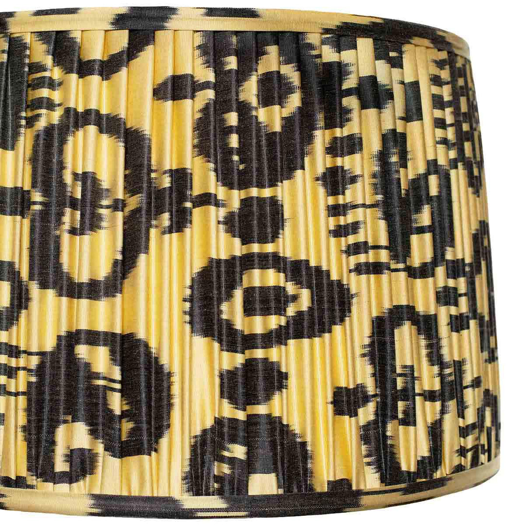 Close-up of the black on cream ikat design on Mekhann's lampshade, emphasising the artisanal dye technique and texture.