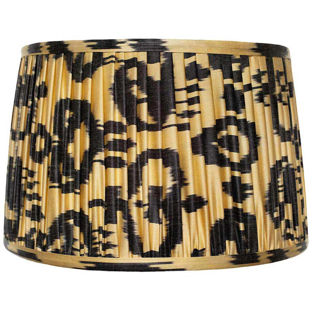 Front view of Mekhann's black on cream ikat silk lampshade, with hand-pleated detailing and natural, sustainable dyes.