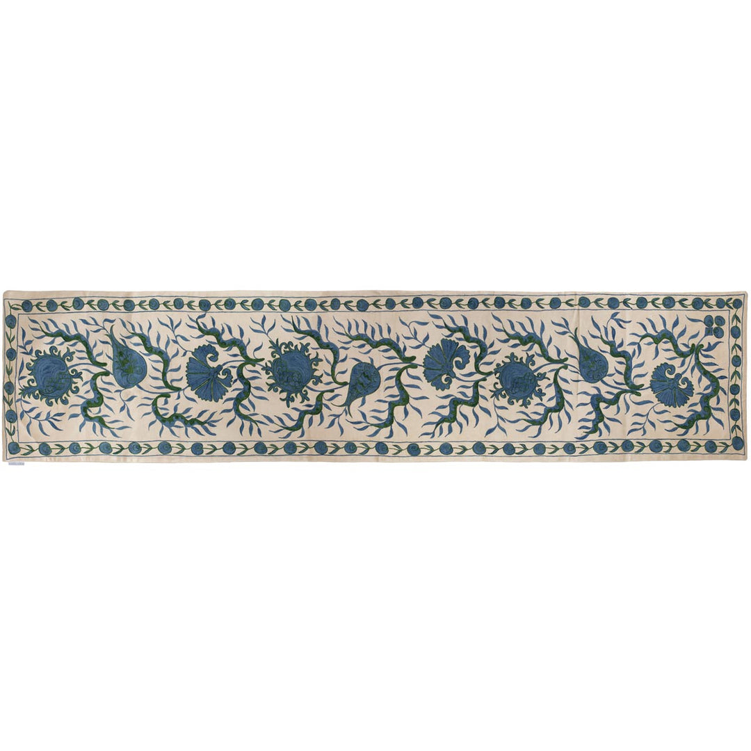 Horizontal front view of Mekhann's cream ottoman vines runner, showing an alternative position of the runner and a different way it can be used.
