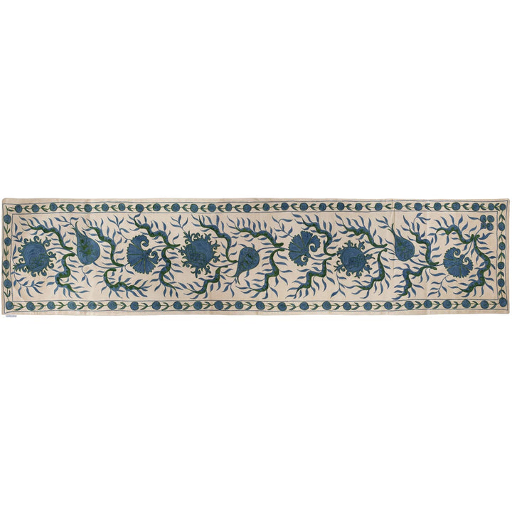 Horizontal front view of Mekhann's cream ottoman vines runner, showing an alternative position of the runner and a different way it can be used.