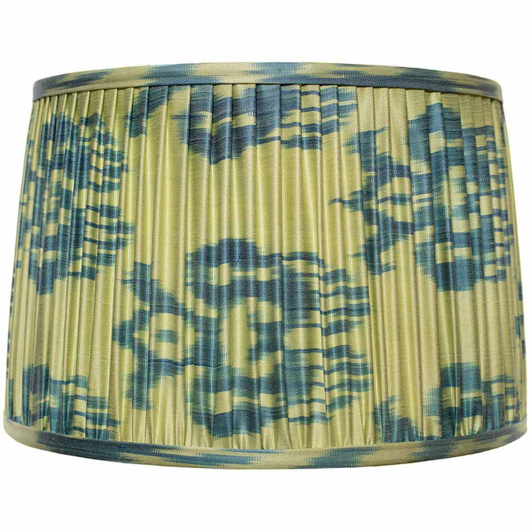 Front view of Mekhann's blue and lime ikat silk lampshade, hand-pleated with vibrant, sustainable dyes for an energizing ambiance.